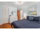 Cozy bedroom featuring a dresser, art, hardwood floors, and natural light from the window at 1416 Edge Dr., North Myrtle Beach, SC 29582