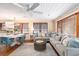 Bright and airy living room features hardwood floors, a large sectional couch and an adjacent dining area at 1416 Edge Dr., North Myrtle Beach, SC 29582