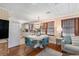 Open-concept living room and kitchen with hardwood floors, a modern light fixture, and comfortable seating at 1416 Edge Dr., North Myrtle Beach, SC 29582