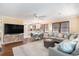 Bright living room featuring hardwood floors, comfortable seating, and an open floor plan into the kitchen area at 1416 Edge Dr., North Myrtle Beach, SC 29582
