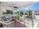 Inviting screened porch offers ample seating with view of the neighborhood and features a ceiling fan at 1416 Edge Dr., North Myrtle Beach, SC 29582