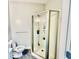 Modern bathroom with glass enclosed shower, toilet, and grey walls at 1421 Shoreline Dr., Myrtle Beach, SC 29577