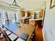 Well-lit dining room and kitchen featuring wood floors, cabinets, and stainless appliances at 1421 Shoreline Dr., Myrtle Beach, SC 29577
