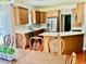 Eat-in kitchen features white countertops, stainless refrigerator, and wooden cabinets at 1421 Shoreline Dr., Myrtle Beach, SC 29577