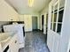 Bright laundry area with white cabinets, a sink, and included washer and dryer at 1421 Shoreline Dr., Myrtle Beach, SC 29577