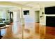 Open-concept living room with hardwood floors, fireplace, and media center at 1421 Shoreline Dr., Myrtle Beach, SC 29577