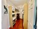 A walk-in closet with wood floors and shelves, providing ample storage space for clothes and accessories at 1421 Shoreline Dr., Myrtle Beach, SC 29577