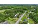 Aerial view of a home nestled in a lush, green neighborhood, marked with a location pin at 169 Ole Maple St., Loris, SC 29569