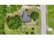 Aerial view of brick home with lush surroundings at 169 Ole Maple St., Loris, SC 29569