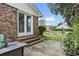 Backyard with brick patio and lush green grass, perfect for outdoor entertaining at 169 Ole Maple St., Loris, SC 29569