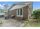 Cozy outdoor patio with brick steps and space to enjoy the backyard at 169 Ole Maple St., Loris, SC 29569
