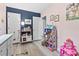 Well-organized playroom, featuring a dollhouse, toy kitchen, and ample room for play at 169 Ole Maple St., Loris, SC 29569
