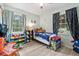 Bright bedroom with lots of natural light, two windows, and ample play space at 169 Ole Maple St., Loris, SC 29569