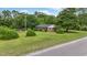 A pleasant view of the home's yard with the brick exterior at 169 Ole Maple St., Loris, SC 29569
