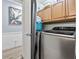Convenient laundry area featuring modern machines and functional storage cabinets at 169 Ole Maple St., Loris, SC 29569