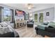 Bright living room featuring hardwood floors, neutral paint, and a comfortable seating arrangement at 169 Ole Maple St., Loris, SC 29569