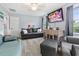 Comfortable living room with modern decor, a large TV, and a neutral color palette at 169 Ole Maple St., Loris, SC 29569