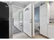 Mud room with white door leading to the backyard and the kitchen entrance at 169 Ole Maple St., Loris, SC 29569