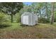 View of corrugated metal shed in backyard surrounded by manicured lawn at 169 Ole Maple St., Loris, SC 29569
