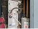 Utility room with Carrier HVAC and hot water heater, showcasing functional home systems at 169 Ole Maple St., Loris, SC 29569