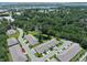 Aerial view of the neighborhood, highlighting mature trees and a community pond at 184 Sea Shell Dr. # 12, Murrells Inlet, SC 29576