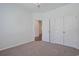 Bedroom with neutral walls, carpet, closet, and doorway to another room at 184 Sea Shell Dr. # 12, Murrells Inlet, SC 29576