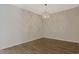 Dining space with a modern lighting fixture and hardwood floors at 184 Sea Shell Dr. # 12, Murrells Inlet, SC 29576