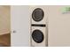 Stacked washer and dryer are showcased in the laundry area at 184 Sea Shell Dr. # 12, Murrells Inlet, SC 29576