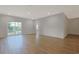 Large living space with wood-look flooring and a sliding glass door to outdoor area at 184 Sea Shell Dr. # 12, Murrells Inlet, SC 29576