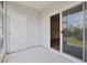 Screened porch with white door and view of the inside of the house at 184 Sea Shell Dr. # 12, Murrells Inlet, SC 29576