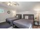 Inviting bedroom with two beds, ceiling fan, and warm lighting at 1930 Lake View Circle, Myrtle Beach, SC 29575