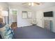 Spacious bedroom features hard surface floors, television and bright natural lighting at 1930 Lake View Circle, Myrtle Beach, SC 29575