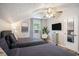Bright bedroom with two beds, wood-look floors, ceiling fan and a mounted TV at 1930 Lake View Circle, Myrtle Beach, SC 29575