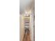 Walk-in closet features shelving and laminate wood floor at 1930 Lake View Circle, Myrtle Beach, SC 29575
