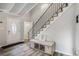 Inviting foyer with bench seating, staircase, and a view of the front door entrance at 1930 Lake View Circle, Myrtle Beach, SC 29575