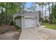Exterior of the house featuring an attached garage and manicured landscaping at 1930 Lake View Circle, Myrtle Beach, SC 29575