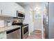 Updated kitchen features stainless steel appliances, granite countertops, and wood-look flooring at 1930 Lake View Circle, Myrtle Beach, SC 29575