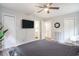 Bedroom with ceiling fan, hard wood floors, and access to bathroom at 1930 Lake View Circle, Myrtle Beach, SC 29575