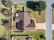 A high angle aerial photograph of a home and its manicured landscape and fenced in back yard at 200 Silverbelle Blvd., Longs, SC 29568