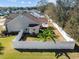 Aerial view of a fenced yard with green grass and a patio area, perfect for outdoor entertaining at 200 Silverbelle Blvd., Longs, SC 29568