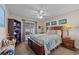 Cozy bedroom with a decorative quilt on the bed, ceiling fan, and wooden furnishings providing a comfortable retreat at 200 Silverbelle Blvd., Longs, SC 29568