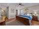 Relaxing bedroom featuring a wood-framed bed, stylish decor, and hardwood floors at 200 Silverbelle Blvd., Longs, SC 29568