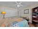 Inviting bedroom featuring neutral walls, a ceiling fan, and a comfortable-looking bed with a colorful quilt at 200 Silverbelle Blvd., Longs, SC 29568