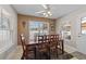Bright dining room featuring a wooden table, natural lighting, and a ceiling fan at 200 Silverbelle Blvd., Longs, SC 29568