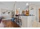 Stylish kitchen with counter seating, pendant lighting, and an open layout connecting to the living area at 200 Silverbelle Blvd., Longs, SC 29568