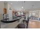 Modern kitchen with a breakfast bar, granite countertops, and a view into the dining room at 200 Silverbelle Blvd., Longs, SC 29568