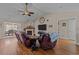 Comfortable living room with vaulted ceilings, a fireplace, and a view into the dining area at 200 Silverbelle Blvd., Longs, SC 29568
