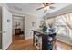 Bright home office with a crafting table, and built in storage. Natural light streams through sheer curtains at 200 Silverbelle Blvd., Longs, SC 29568