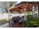 Comfortable outdoor patio features a gazebo with stylish seating, plants, and a serene backyard ambiance at 200 Silverbelle Blvd., Longs, SC 29568