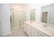 Bright bathroom featuring double sinks, glass shower, and modern fixtures to create a clean and stylish space at 2002 Sweetflag Dr., Longs, SC 29568